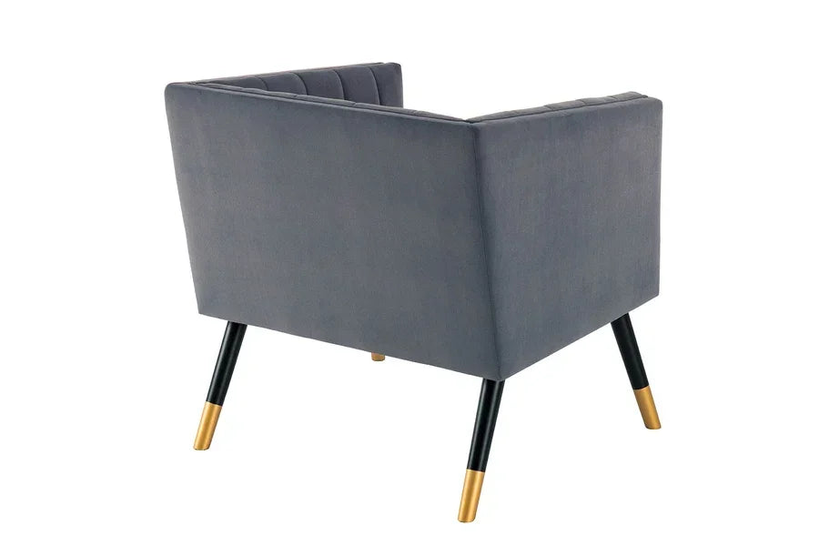 Grey velvet armchair with gold-tipped black legs, rear angled view