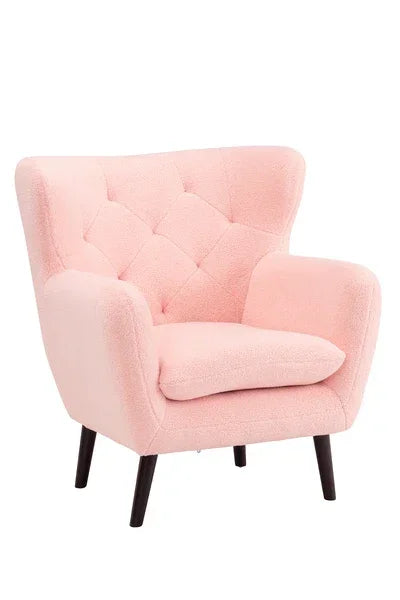 Pink accent armchair with tufted back and angled wooden legs