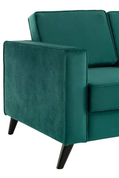 Teal velvet sofa corner with slim black legs and square armrest