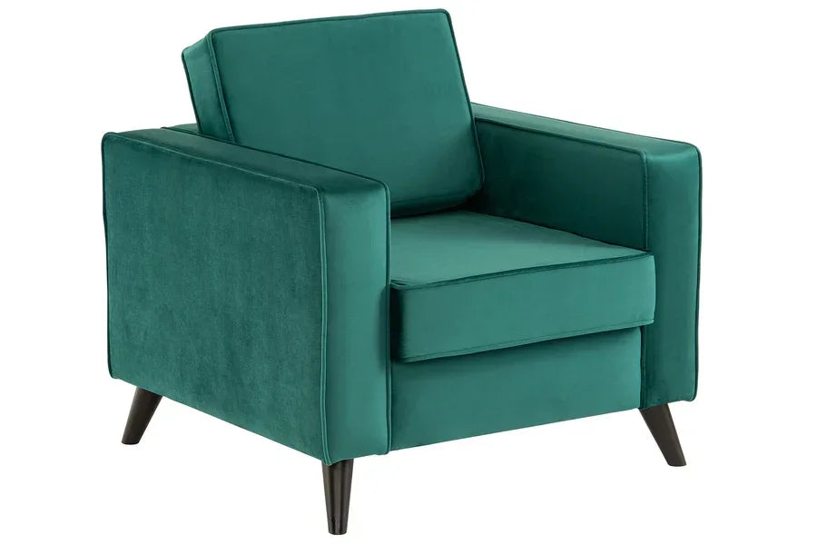 Green velvet armchair with angled black legs and cushioned backrest