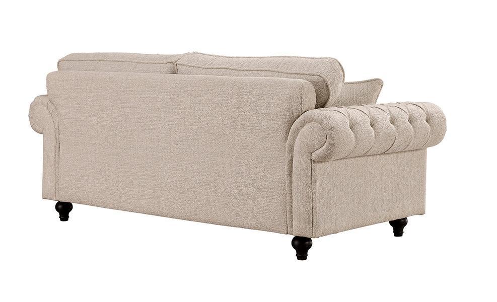 Beige fabric Chesterfield sofa with button-tufted arms and turned wooden legs, rear angle
