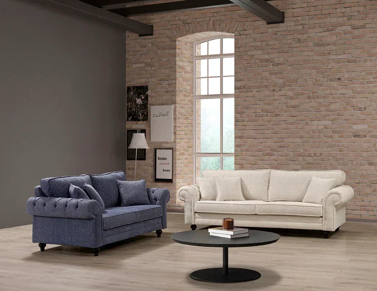 Blue fabric sofa and cream fabric sofa with scatter cushions in modern living room