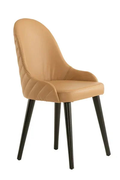 Tan dining chair with padded seat, quilted backrest and black angled legs
