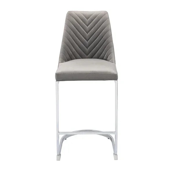 Grey velvet bar stool with chevron stitched backrest and chrome legs, front view