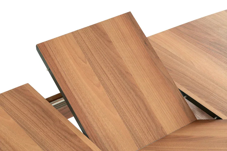 Closeup of wood dining table with extension leaf mechanism visible
