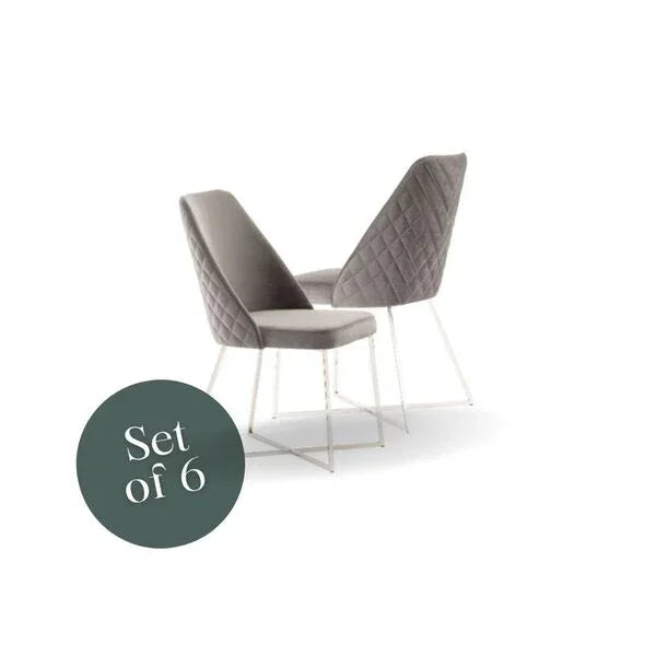 Set of six grey velvet dining chairs with quilted backs and white metal legs