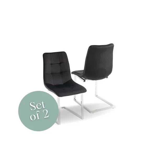 Set of 2 black dining chairs with chrome cantilever legs, front and rear view