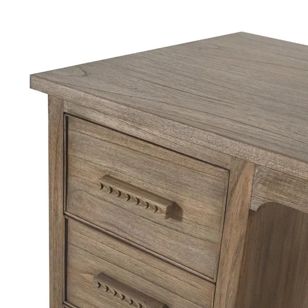 Oak wood desk with side drawers and textured handles, close-up of corner detail