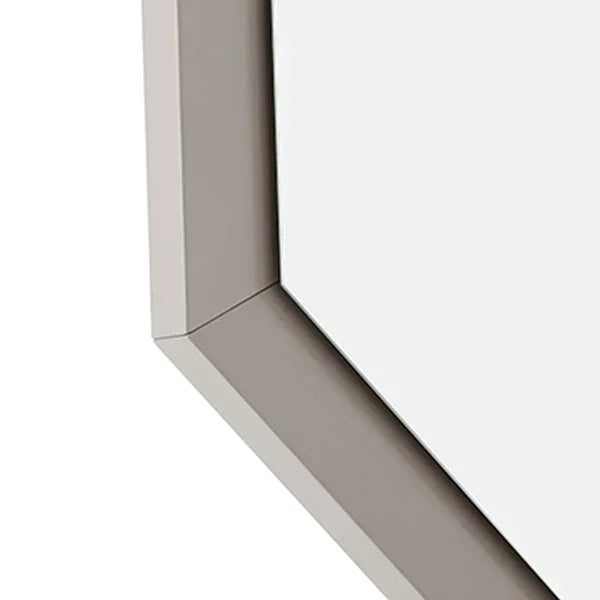 Close-up of taupe wooden mirror frame with beveled edge