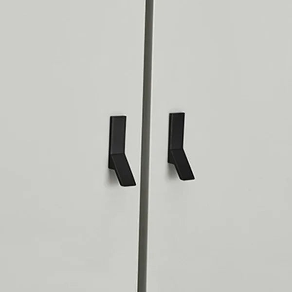 Wardrobe closeup showing modern black metal handles on matte white doors