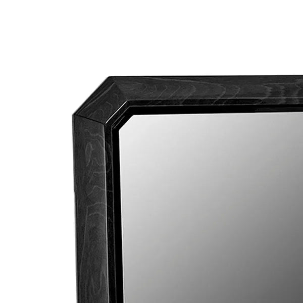 Close up of black wood mirror frame with sleek mitered edge detail
