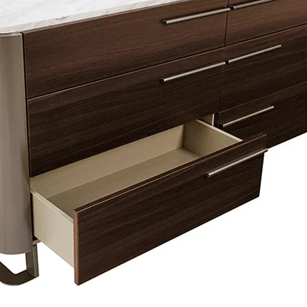 Dark wood chest of drawers with metal handles and one drawer open