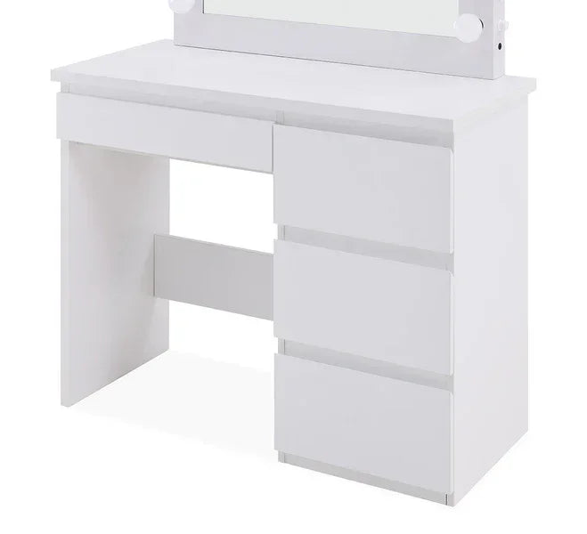 Close-up of white vanity table with three-drawer stack, open kneehole and mirror above