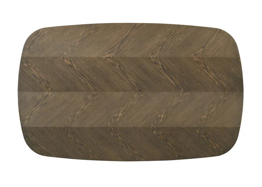 Rectangular wooden dining table top with chevron grain pattern, bird’s-eye view