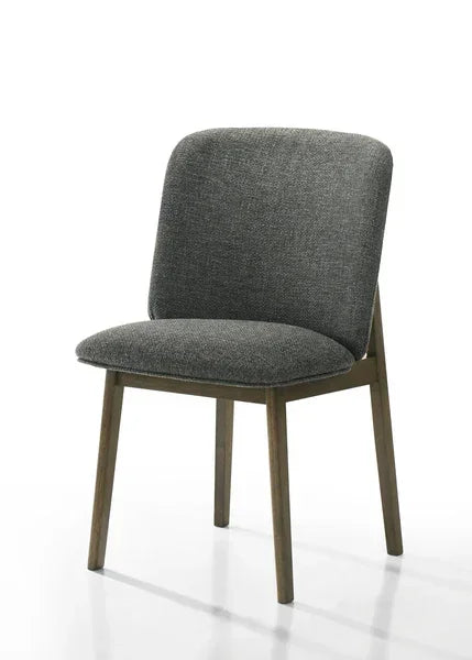 Grey fabric dining chair with padded seat and wooden legs on white background