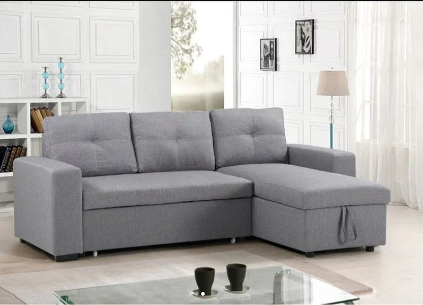 Grey fabric corner sofa with storage chaise in a bright modern living room