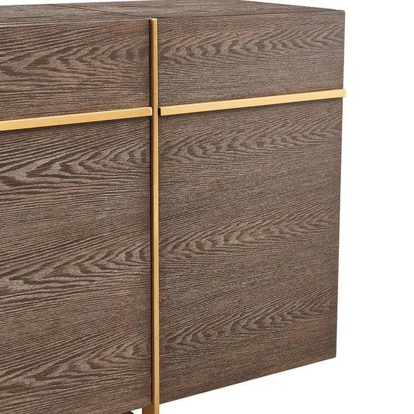 Close-up of wood grain sideboard cabinet with gold trim detailing