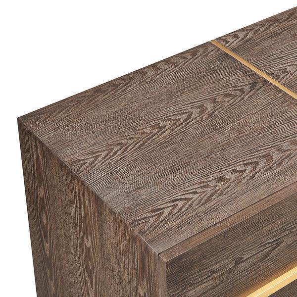Corner view of wood grain bedside table with gold accent detail