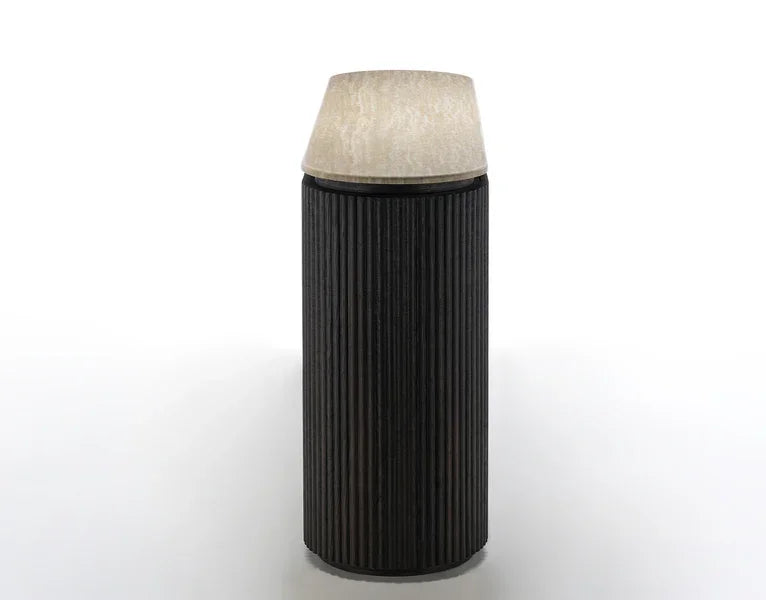 Black fluted side table with light stone top photographed from the front