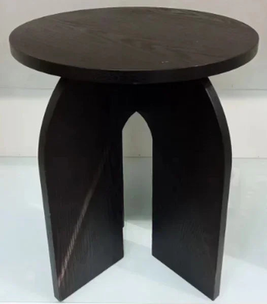 Dark wood side table with round top and arched cutout base on white background