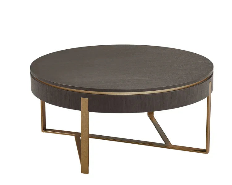 Round coffee table with dark wood top and gold metal frame