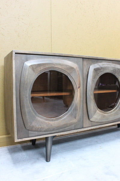 Wooden sideboard with rounded glass door panels and tapered legs