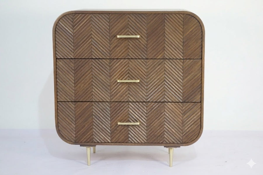 Sonar chest of 3 drawers in dark mango wood with layered chevron drawer fronts and gold-tone handles and legs, front view on plain background