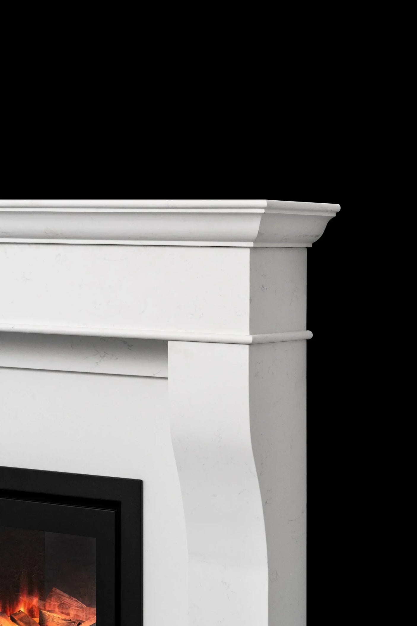 White marble fireplace surround with classic molding and electric fire detail