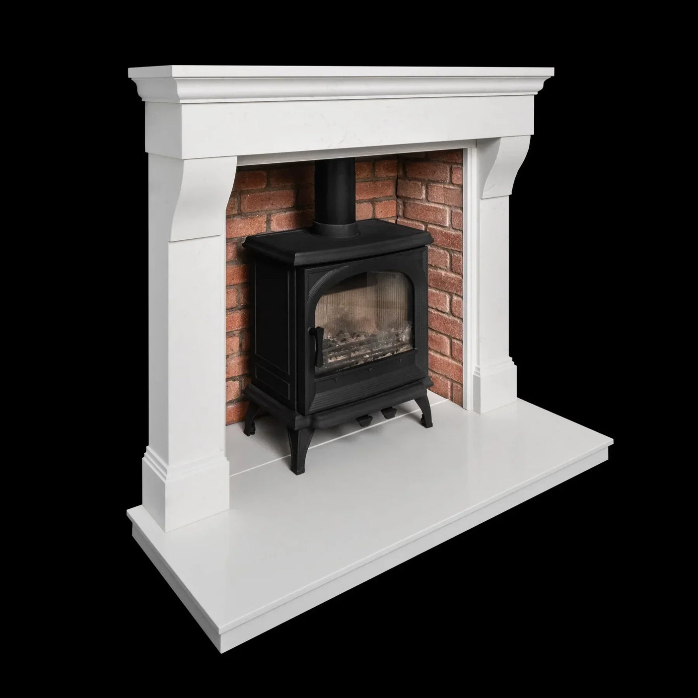 White marble fireplace surround with brick inset and black freestanding wood stove