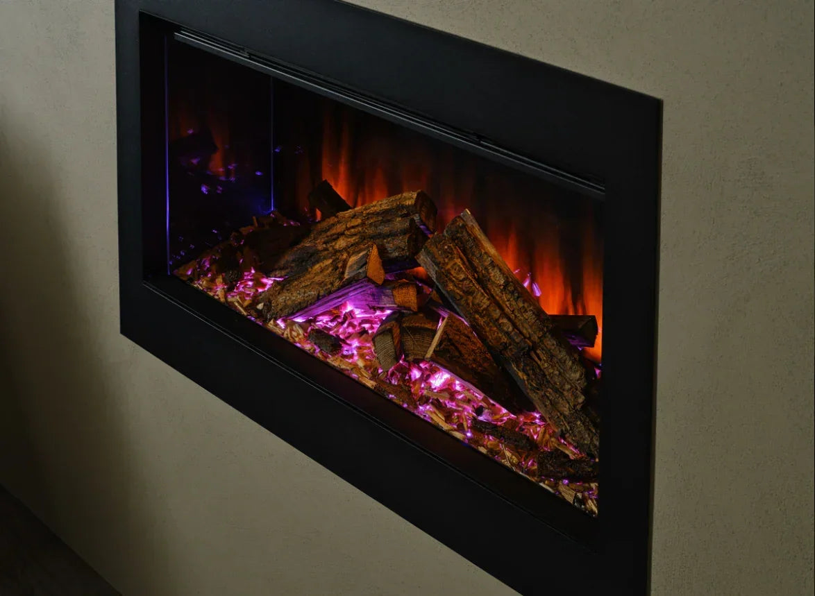 Electric fireplace with realistic log effect and glowing pink ember bed