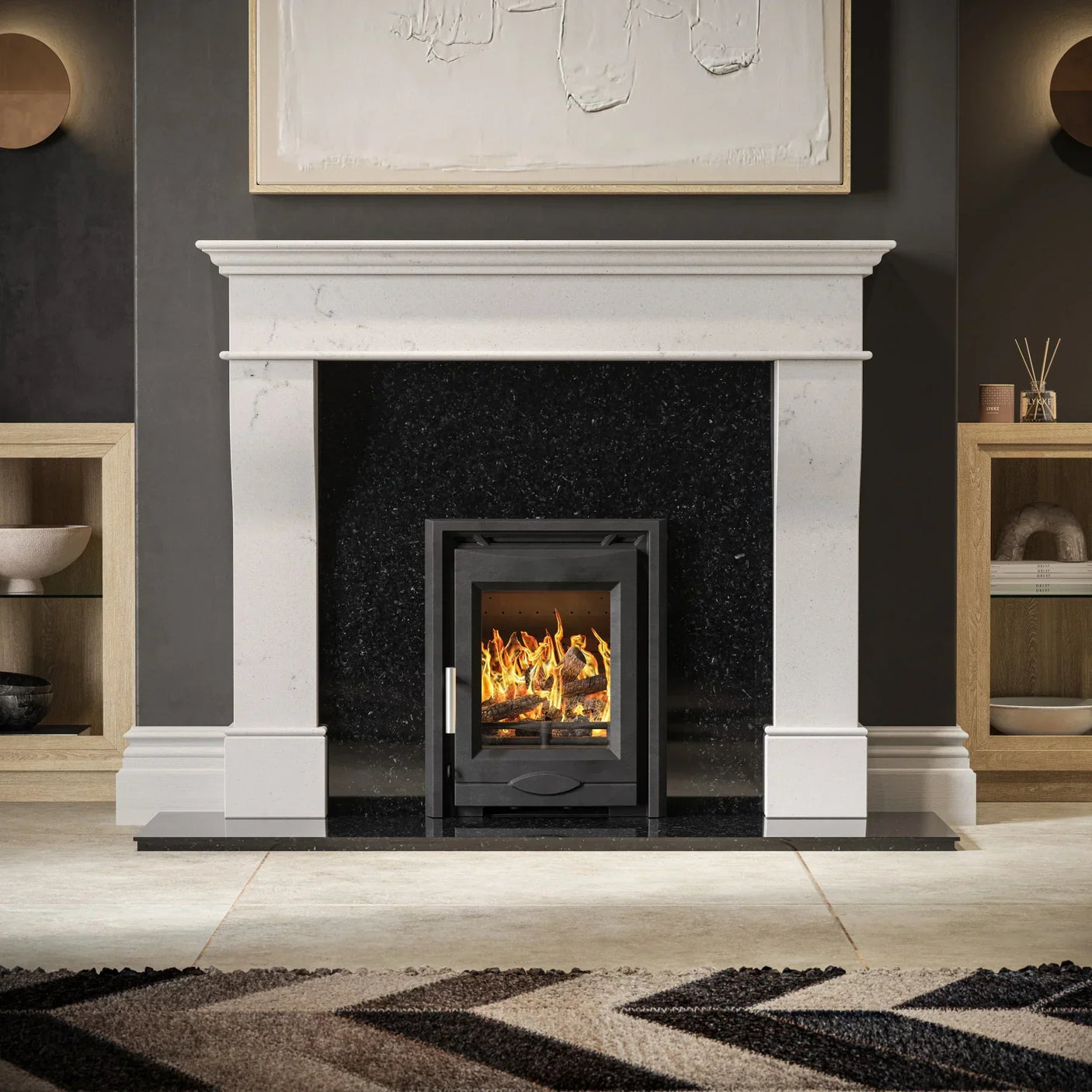 Modern marble fireplace with black wood burning stove and textured rug in living room