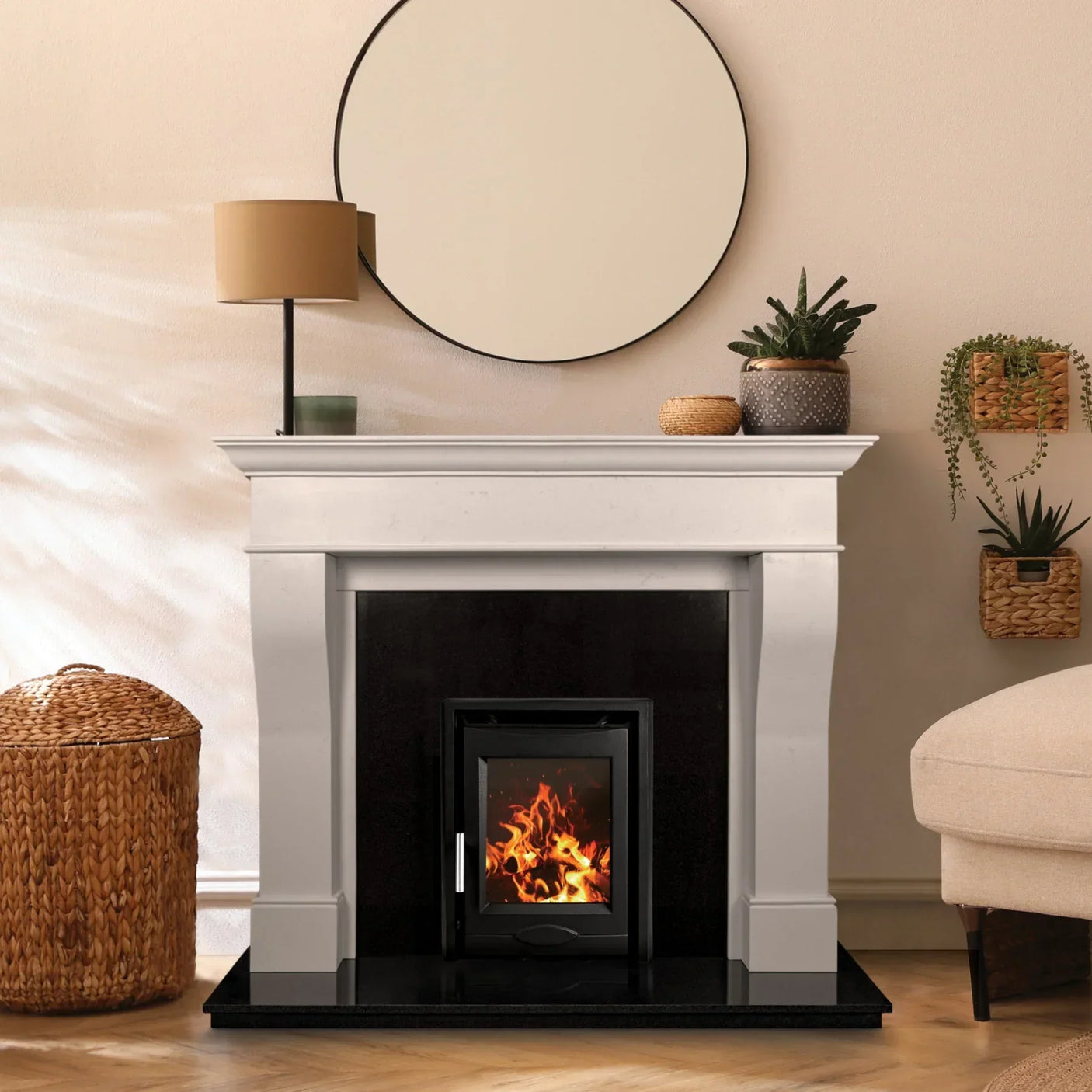 Portland white fireplace surround with modern stove in living room setting