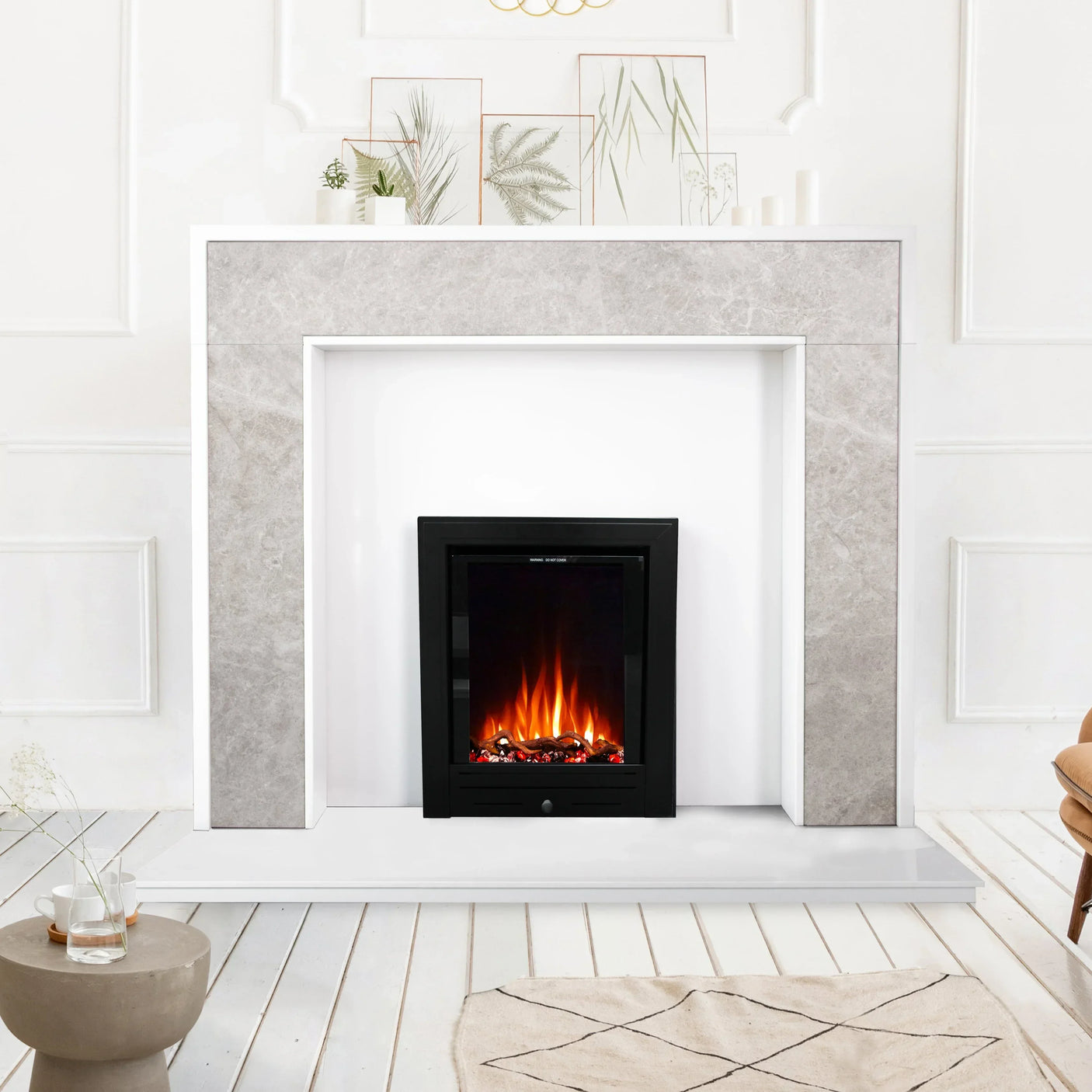 Modern electric fireplace suite with stone effect surround in bright living room setting