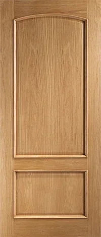 Oak interior panel door with arched top panel and natural wood grain finish