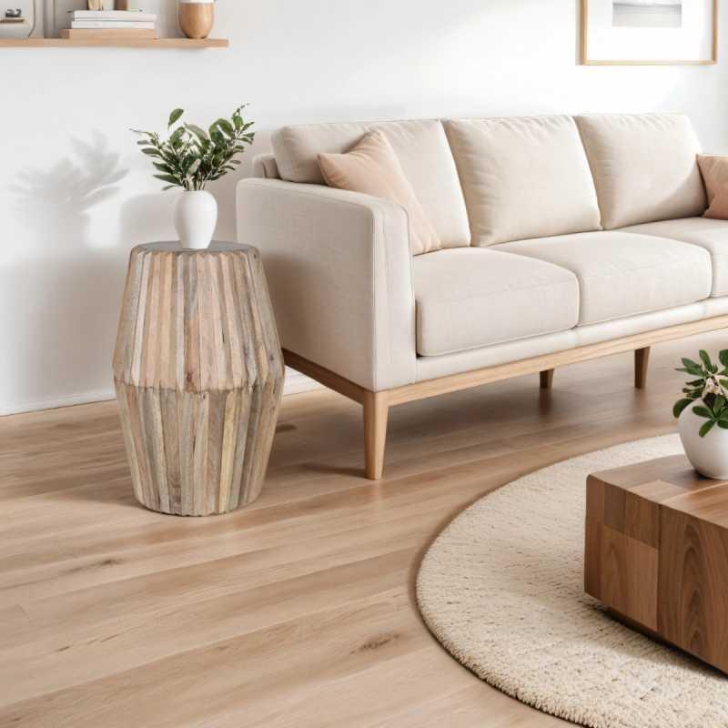 Neutral fabric sofa with wooden legs beside rustic wooden side table in modern living room