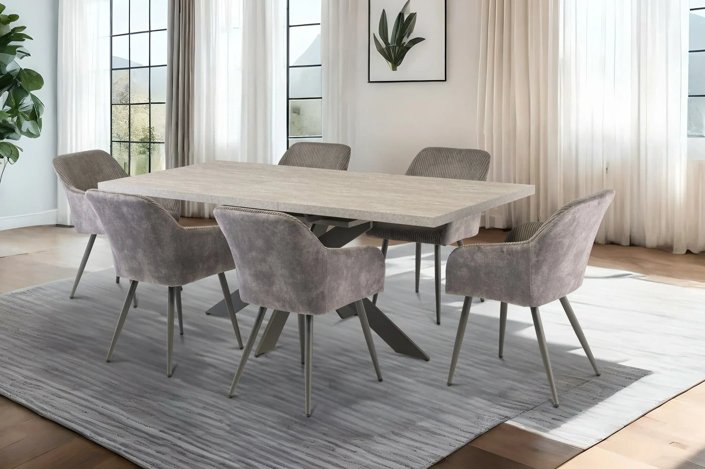 Modern dining table with six grey upholstered chairs on a large grey rug in bright room