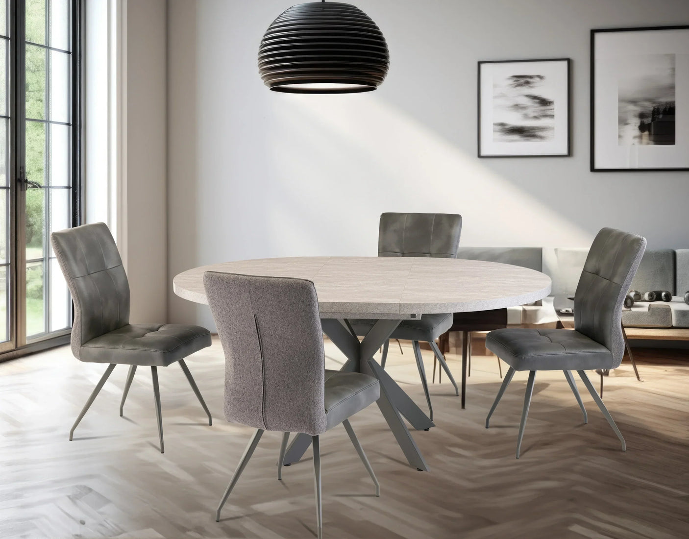Round wood dining table with grey faux leather chairs in modern dining room