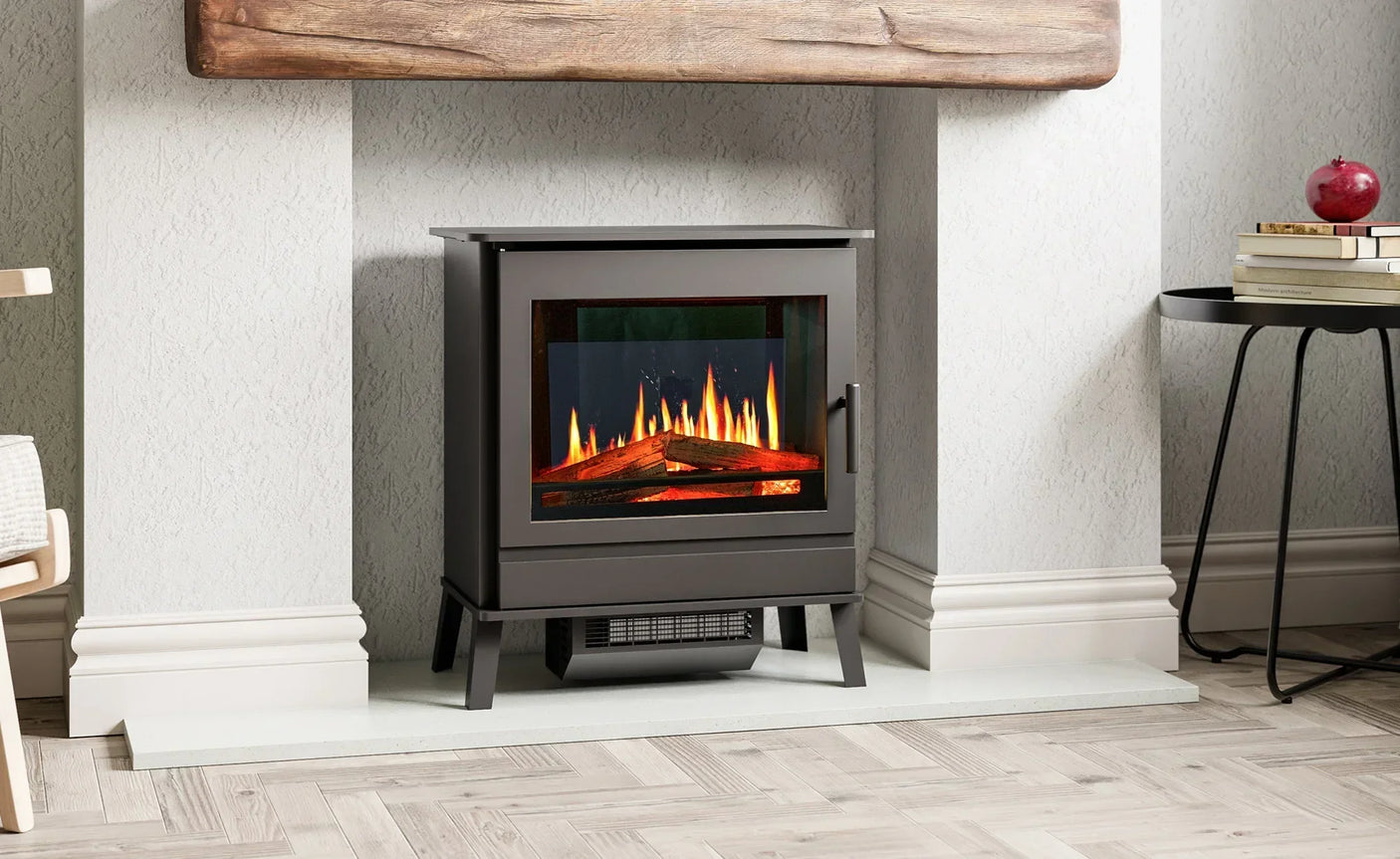 Black electric fireplace stove with glass front and realistic flame in living room alcove