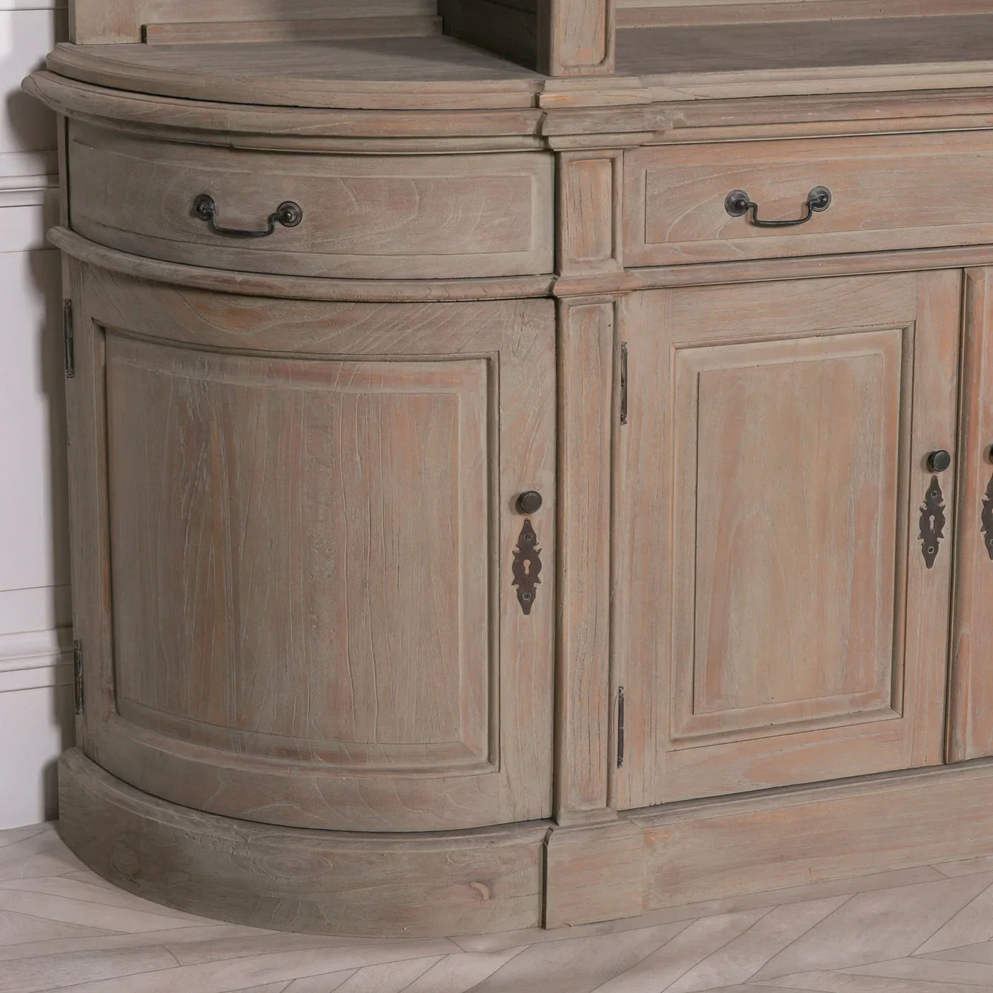 Rustic wooden sideboard with curved cabinet doors and metal handles in natural finish