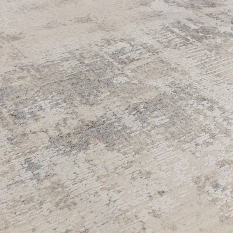 Cream and grey area rug with abstract textured pattern closeup