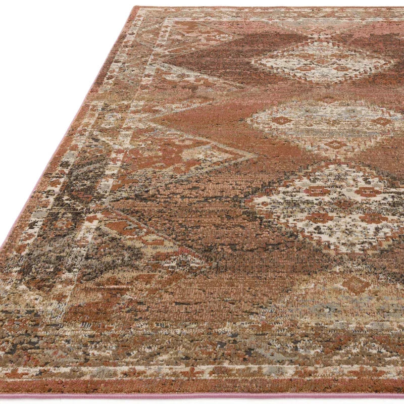 Brown patterned area rug with geometric diamond motifs and textured weave