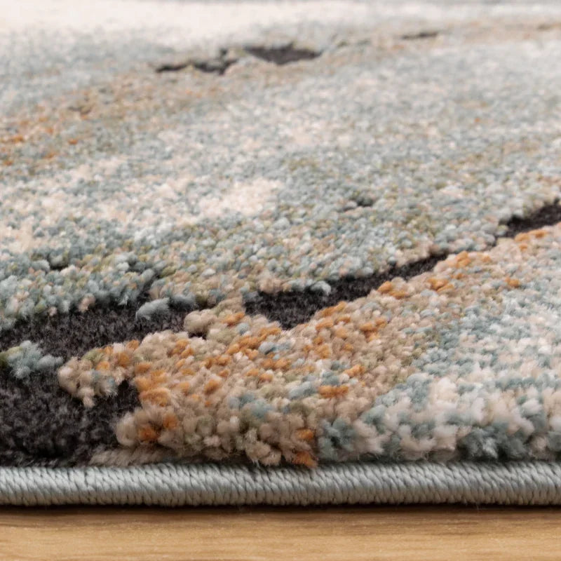 Close up of textured multicolour rug edge on wooden floor