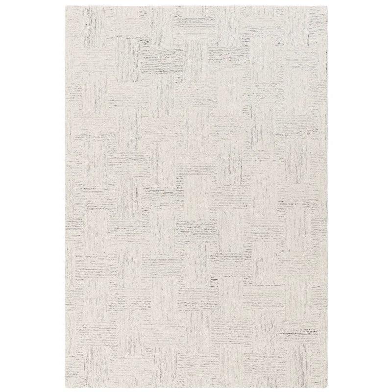 Rectangular beige area rug with subtle geometric pattern and textured weave