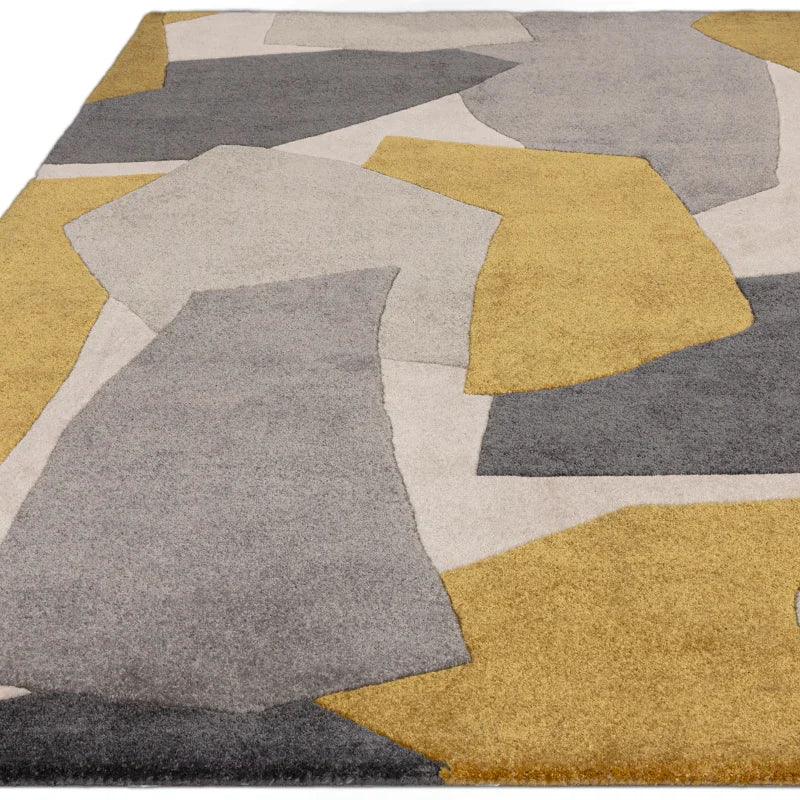 Modern area rug with abstract geometric pattern in yellow, grey, and cream tones