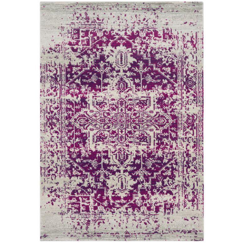 Purple and cream distressed area rug with ornate central medallion and vintage pattern