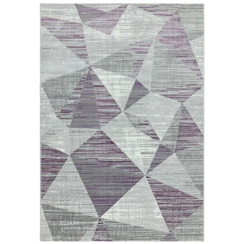 Geometric area rug with purple, grey and white shapes on a modern pattern background