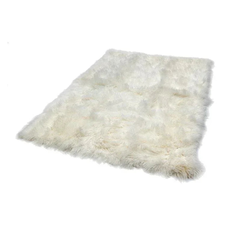 white fluffy sheepskin rug on plain background