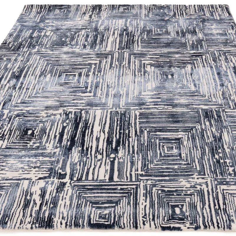 Blue and white abstract patterned rug with geometric square design