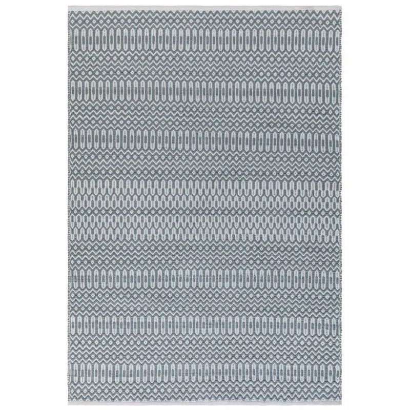 Grey geometric patterned area rug with zigzag and oval stripes, top-down view