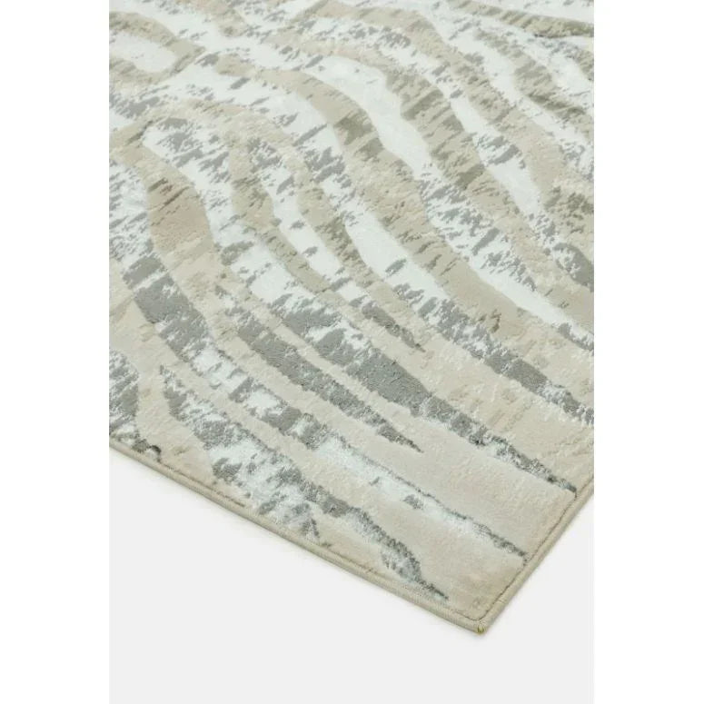 Beige and grey abstract area rug with textured pattern and corner detail visible